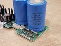 Right side capacitor is 10,000uF @ 40VDC